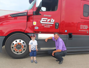 Nathan Snyder with Wendell Erb, President and CEO of Erb Transport