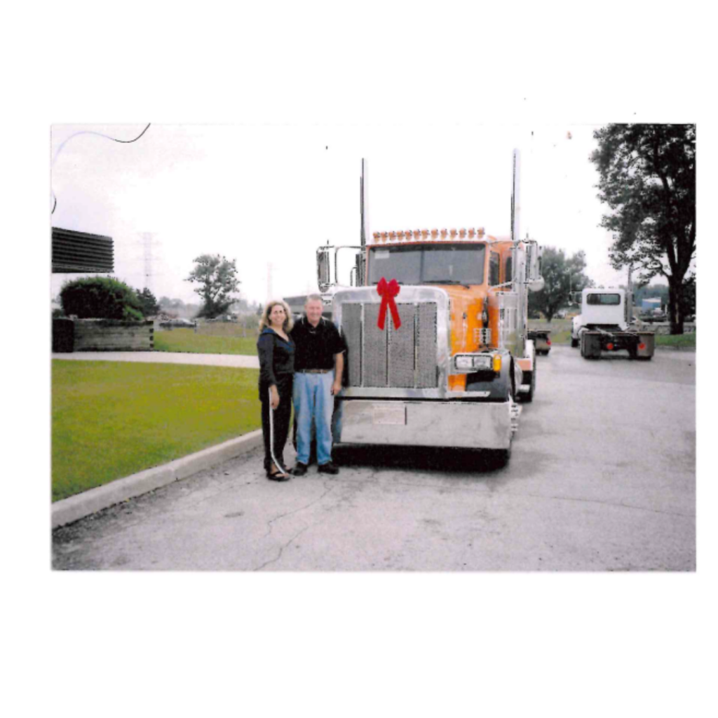 Driver Trainer, Isabel with one of her first trucks in Peterbilt, London, ON. 